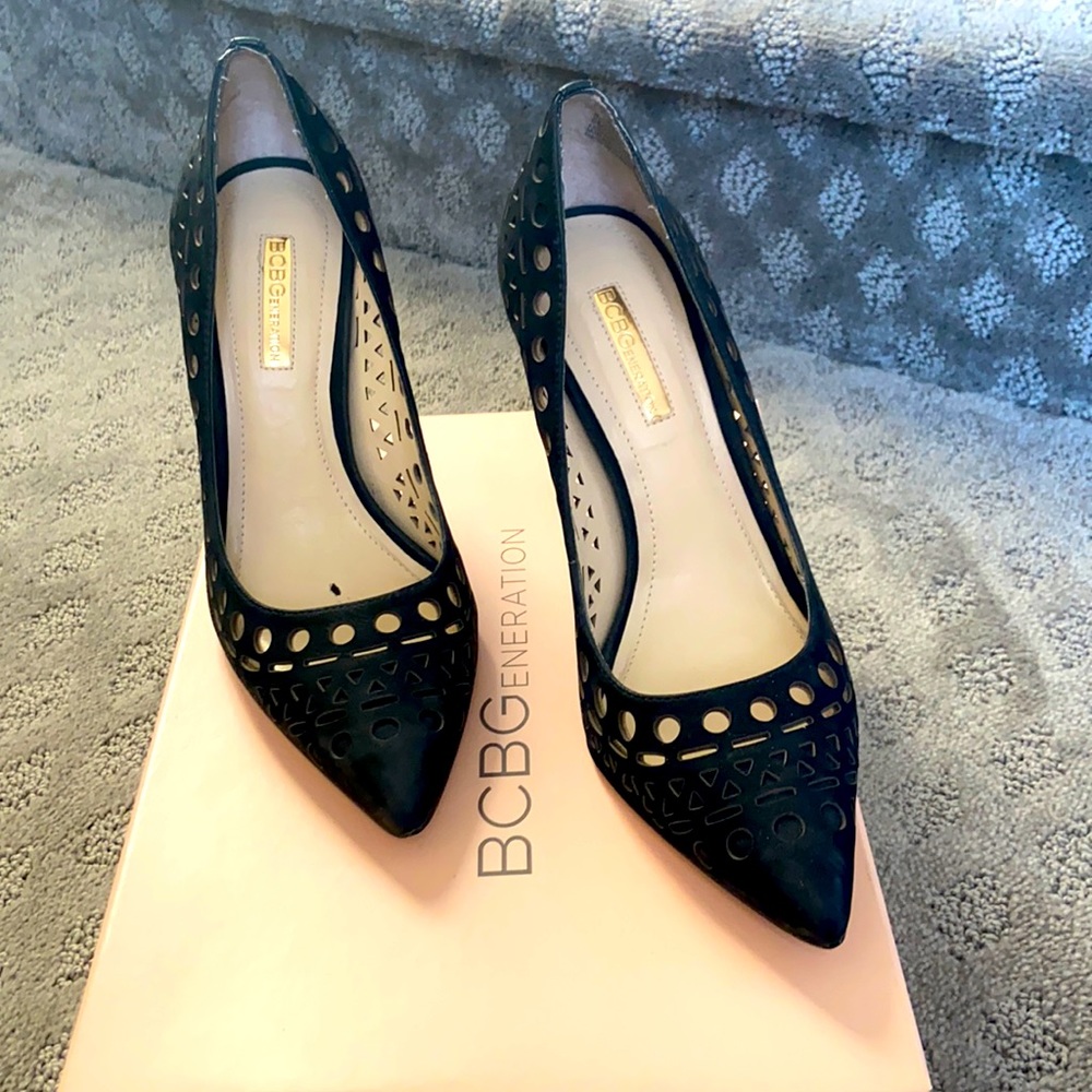 Black pointed toe pumps